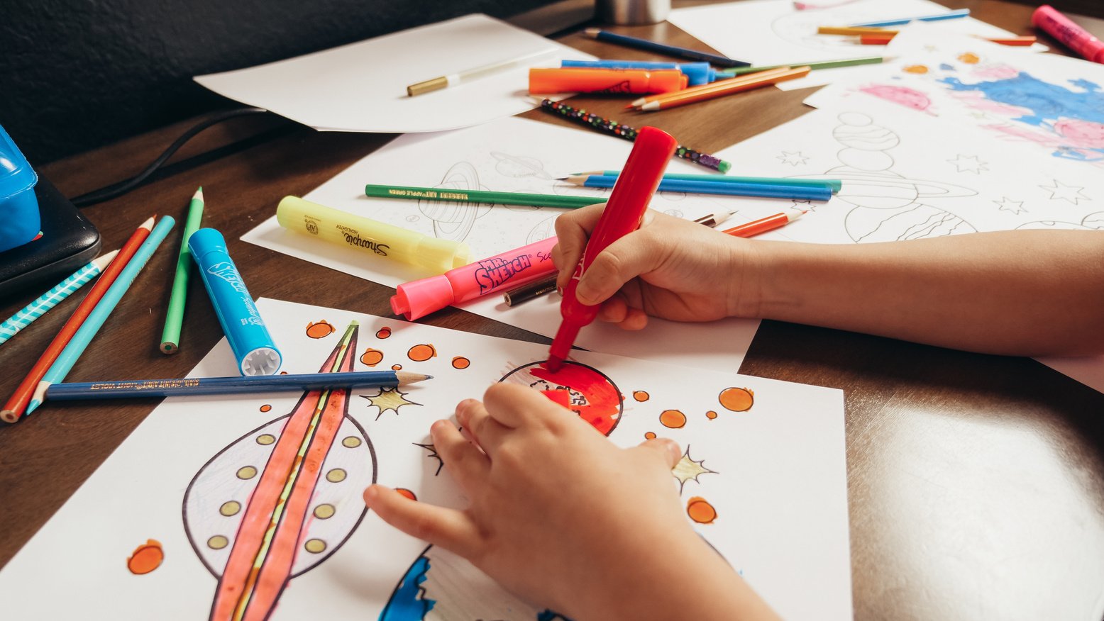 Close-Up Shot of a Kid Coloring